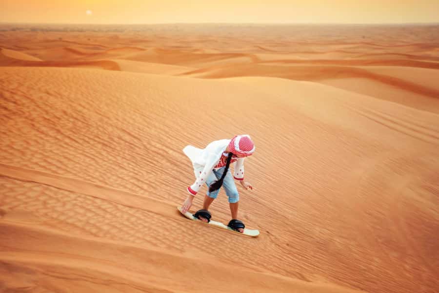 Dubai: Desert Safari, Camel Ride, and BBQ Dinner - Dune bashing across the Dubai desert