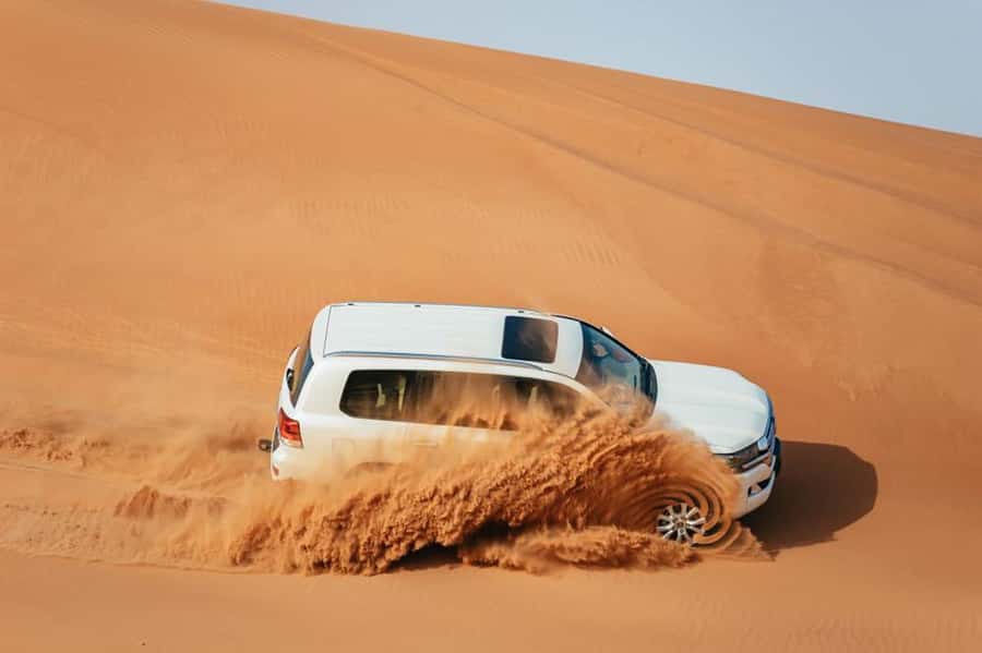 Dubai: Desert Safari, Camel Ride, Sandboarding, Quad Bike - Key points at a glance