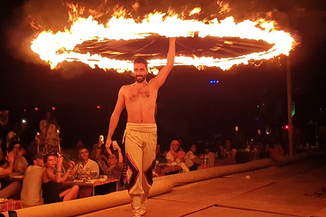 Dubai: Desert Safari, Camel Ride, Show & Optional Dinner - Sandboarding on a tall Lahbab dune