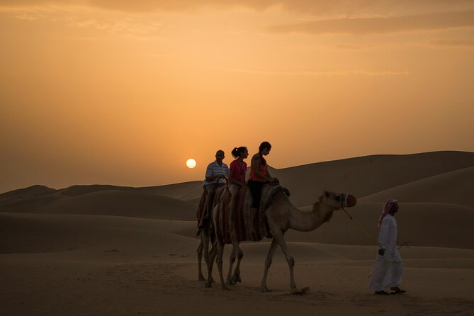 Dubai Desert Safari Dune Bashing, Camel Ride, Sandboarding & BBQ - Camel riding and sandboarding