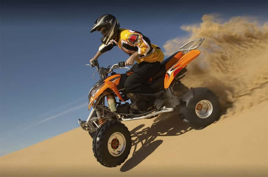Dubai: Desert Safari, Quad Bike, Camel Ride and Sandboarding - Optional quad biking across the open desert