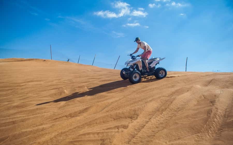 Dubai: Desert Safari, Quad Bike, Camel Ride and Sandboarding - Dune bashing in a Land Cruiser