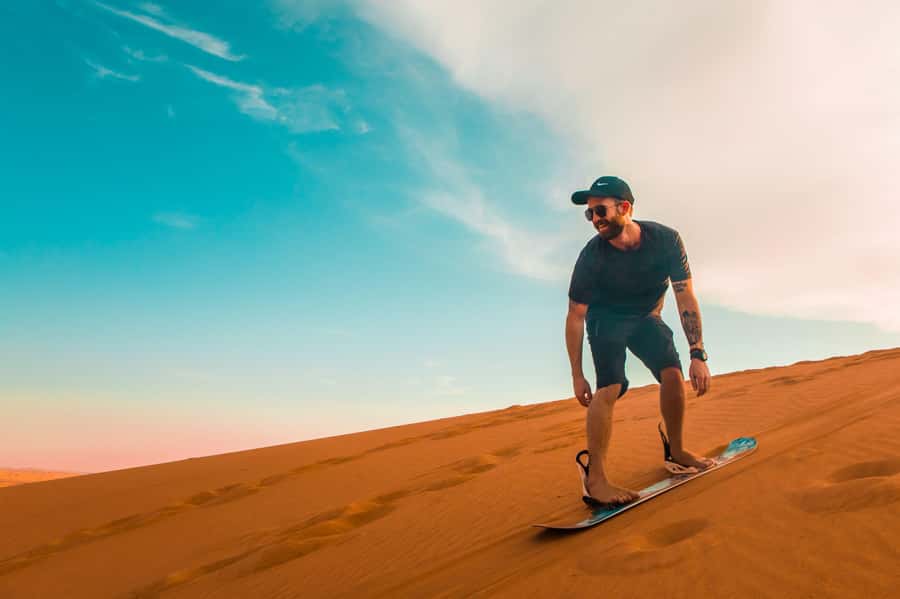 Dubai: Desert Safari, Quad Bike, Sandboarding, Camels & BBQ - Hotel pickup keeps the day simple