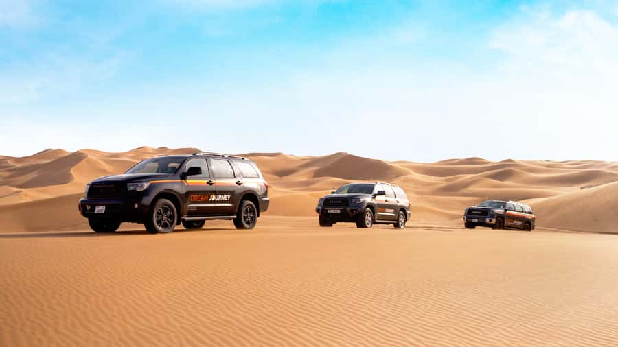 Dubai Desert Safari - Sandboarding, Quad Bike & BBQ Options - Sandboarding on soft desert slopes