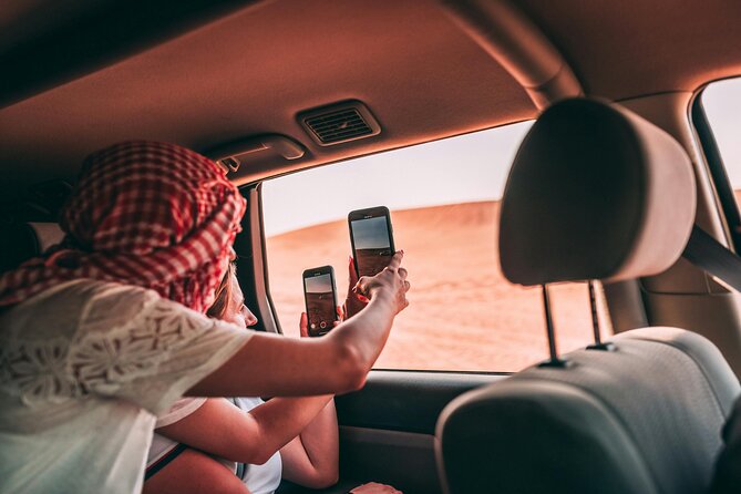 Dubai Desert Safari with BBQ Dinner and Live Shows - Henna and traditional clothing photos