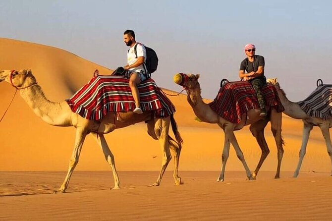 Dubai Desert Safari With Buffet Dinner Tour - Sandboarding and sunset photographs in the open desert