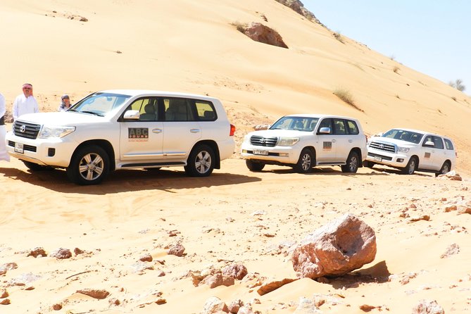 Dubai Desert Safari with Camel Ride, Show, BBQ and Transfers - Sunset, sandboarding, and the busiest part of the evening