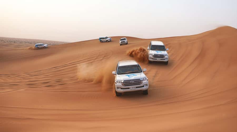 Dubai: Desert Safari with Camp, Dinner, & Optional Overnight - From Dubai hotels to the red dunes