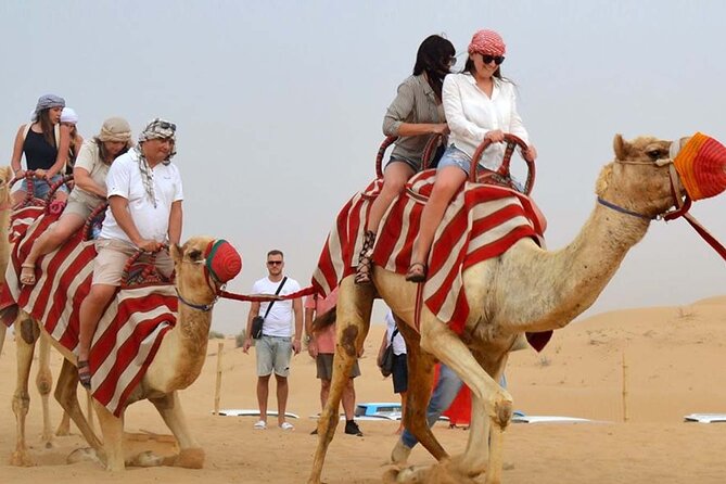 Dubai Desert Safari with Dinner, Camel Ride & Dune Bashing - Belly dancing, tanura, and fire performances