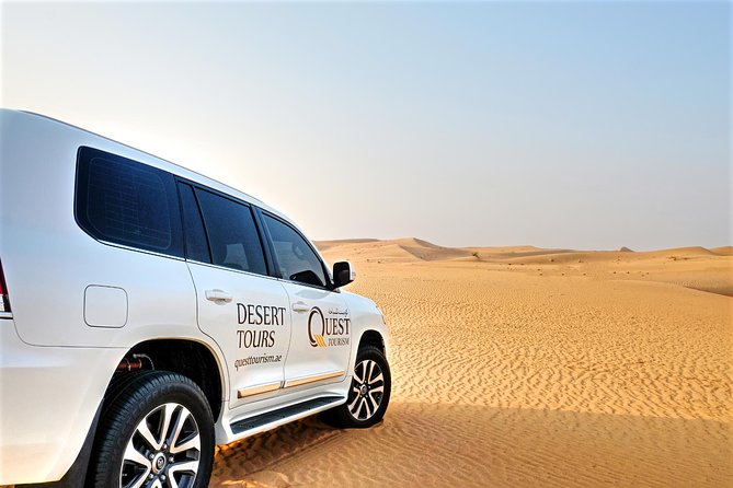 Dubai Desert Safari with Dune Bashing, Camel Rides & BBQ - Sandboarding and a first camel ride
