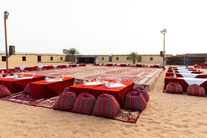 Dubai Desert Safari with Quads, BBQ Dinner, Camel ride, & Shows - Quad bikes, camels, and sand art