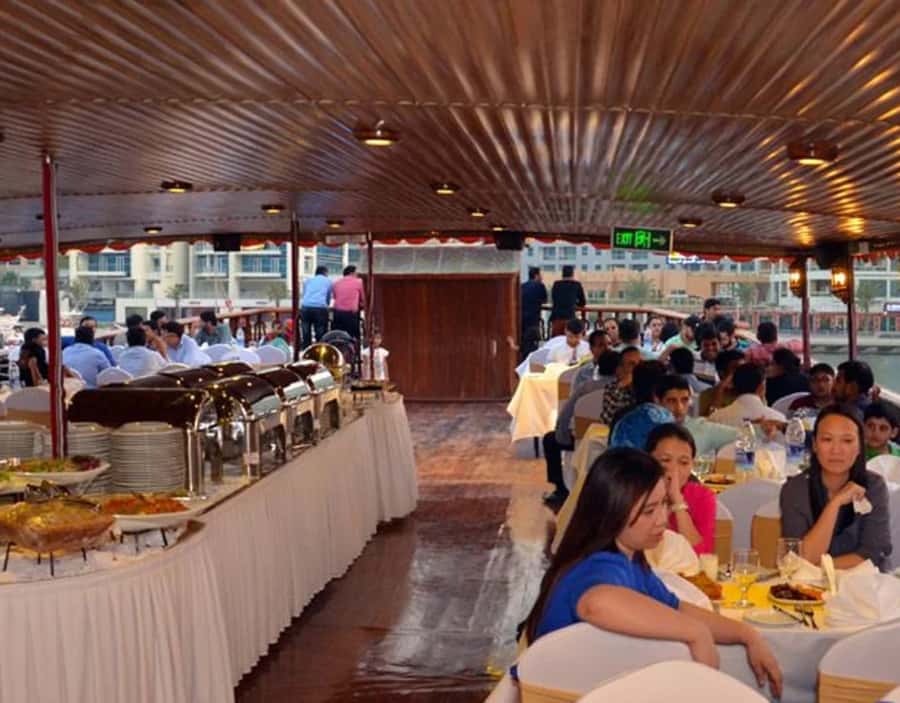 Dubai: Dhow Dinner Cruise on Creek or Marina with Live Shows - Boarding a traditional dhow boat