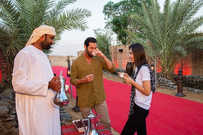 Dubai Evening Desert Safari: Sandboarding, BBQ, Camel Ride & more - A Bedouin-style dinner under the stars