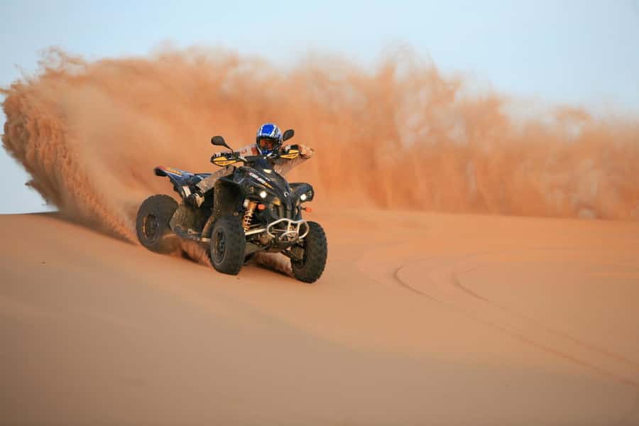 Dubai: Evening Tour with Quad Biking, Camel Ride, and BBQ - From Dubai streets to the red dunes