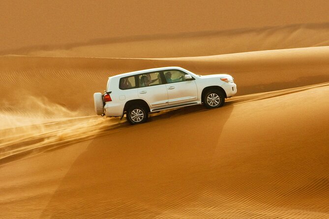 Dubai Evening4x4Desert Safari BBQ Dinner,4 Live Shows,Camel Ride - Sunset photos on the high dunes