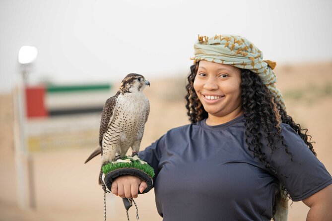 Dubai Half-day Red Dunes bashing with Sandboarding, Camel &Falcon - Falcon photos and Arabic dress