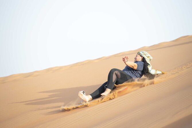 Dubai Half-day Red Dunes bashing with Sandboarding, Camel &Falcon - A short camel ride with a different pace