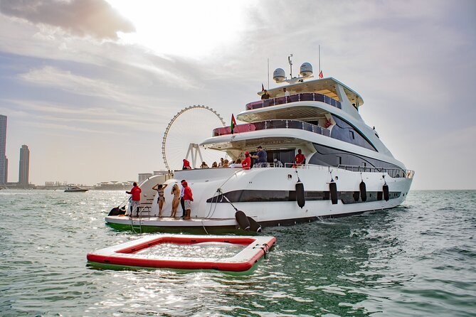 Dubai Harbour Super Yacht Experience with gourmet & Drinks - The meal, drinks, and DJ setup