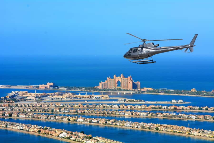 Dubai: Helicopter Ride, Desert Safari, Camels & Refreshments - Quad biking across the red dunes