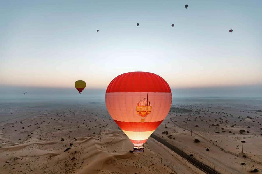 Dubai: Hot Air Balloon, Desert Safari, and Quad Biking Tour - Sunrise above the Dubai Desert Conservation Reserve