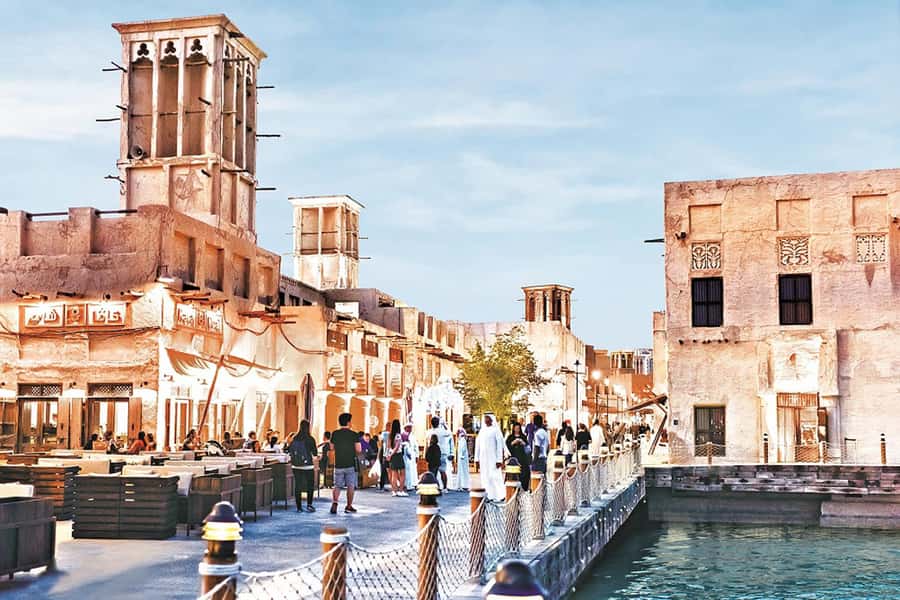 Dubai: Old Town Walking Tour with Abra Cruise & Street Food - Gold Souk: look closely, then keep moving