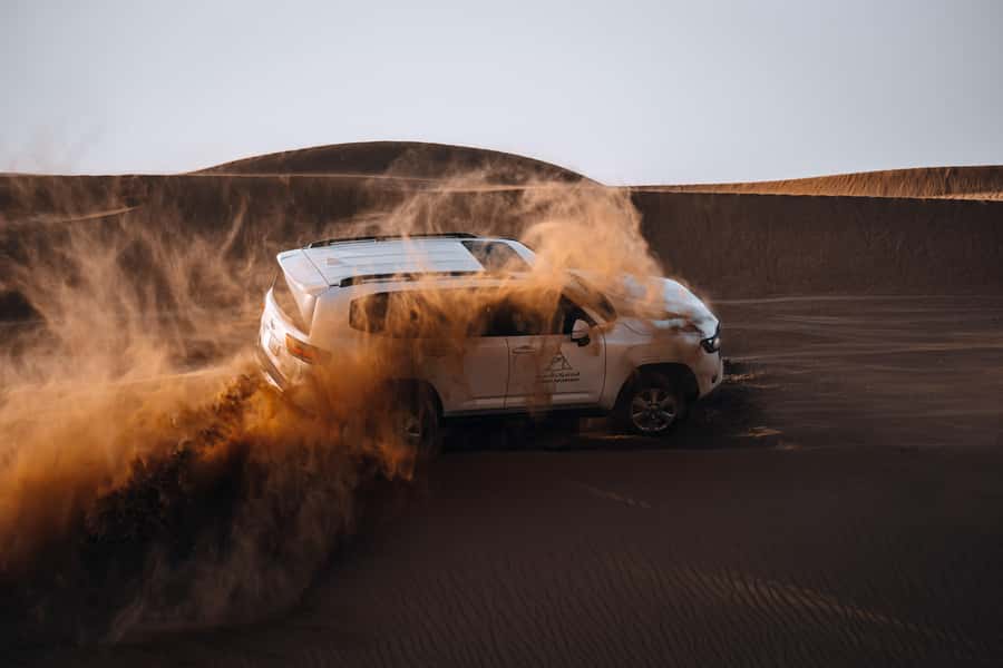 Dubai: Premium Desert Safari, Camel Ride, BBQ & Sandboarding - Leaving Dubai for the red dunes