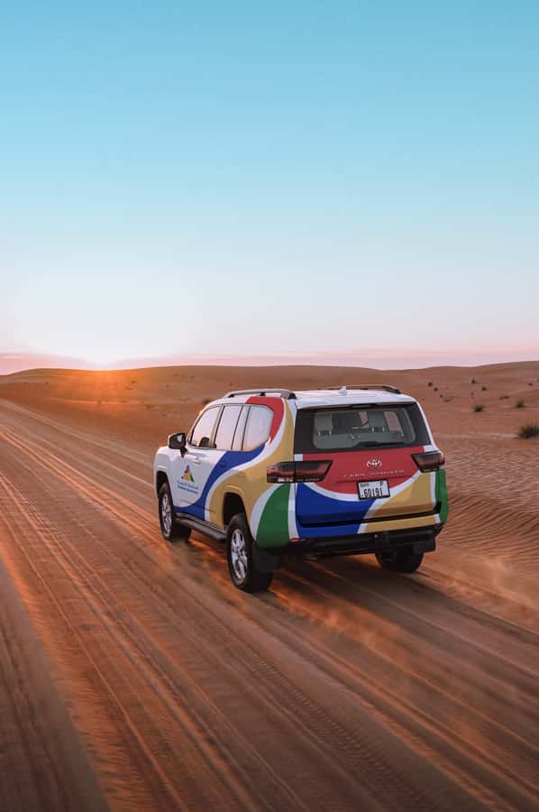 Dubai: Premium Desert Safari, Camel Ride, BBQ & Sandboarding - Dune bashing in a professional 4WD