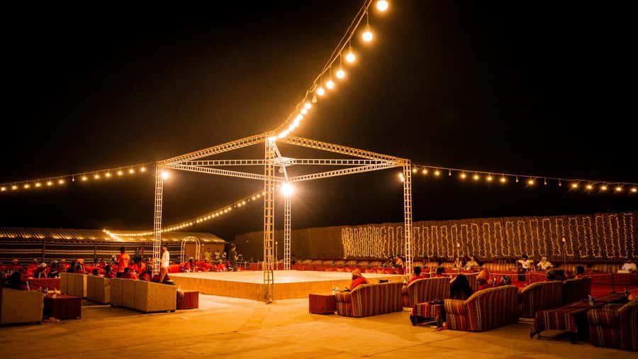 Dubai: Premium Red Dune Safari with Sandboarding & BBQ - Camp activities: henna, sheesha, and falcon photos