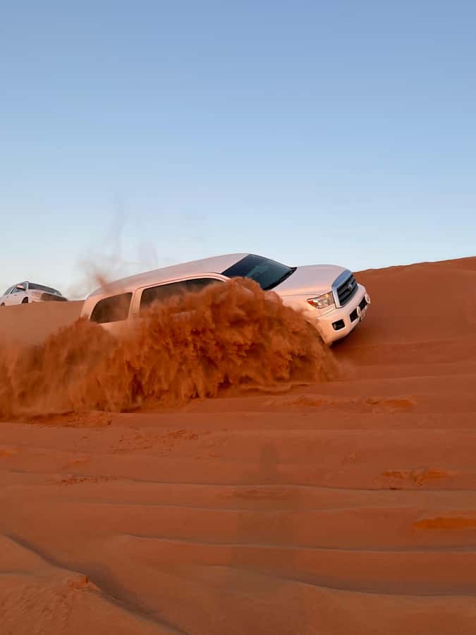 Dubai: Premium Red Dune Safari with Sandboarding & BBQ - Sandboarding and the wide-open desert photo stop