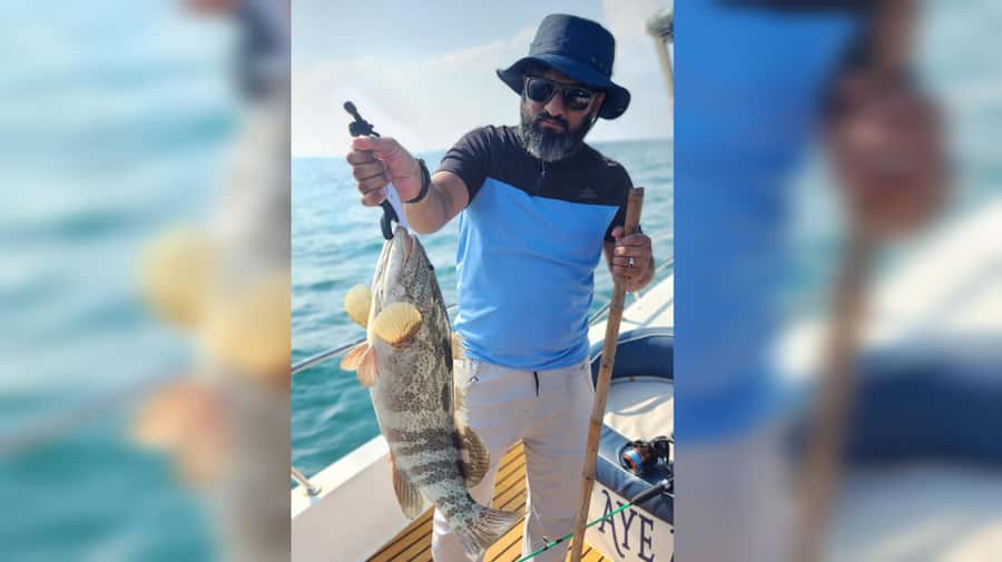 Dubai: Private Deep Sea Fishing Trip with BBQ of Catch - Grilling the catch on the way home
