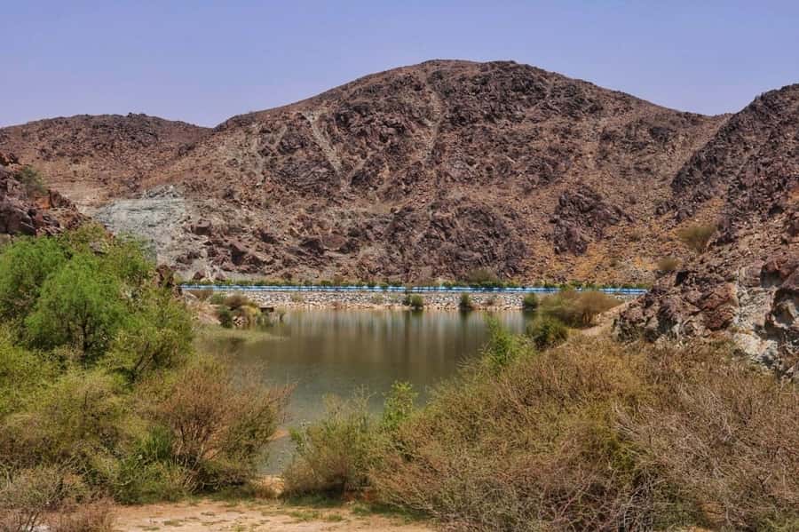 Dubai: Private Desert Day Tour and Wadi Shawka Pool Visit - Wadi Shawka and the Hajar Mountain setting