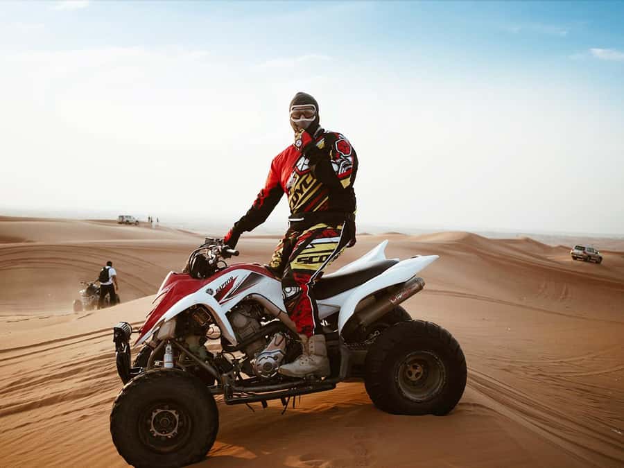 Dubai: Quad Bike or Dune Buggy Adventure & Optional Transfer - Riding across Lehbab’s red dunes