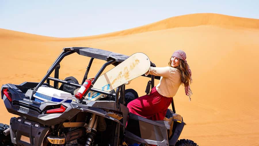 Dubai: Red Dune Desert, Dune Buggy Ride & BBQ Buffet Dinner - Sandboarding, camel rides, and sunset photos