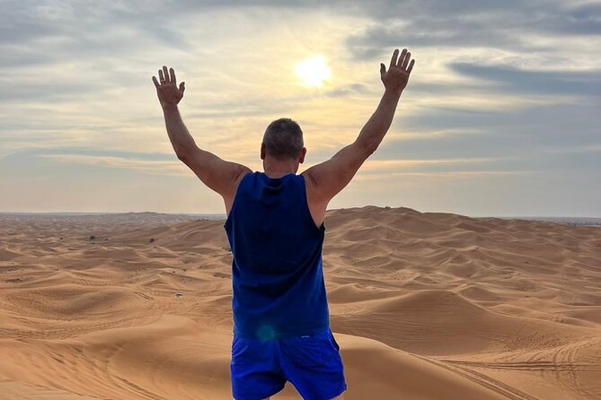 Dubai Red Dune Safari with Bedouin BBQ Dinner & Hotel Transfers - Sandboarding and the best sunset photographs