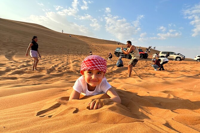Dubai: Red Dunes, Sandsurf, Camel Ride, BBQ Dinner at Desert Camp - Sandboarding on the dunes