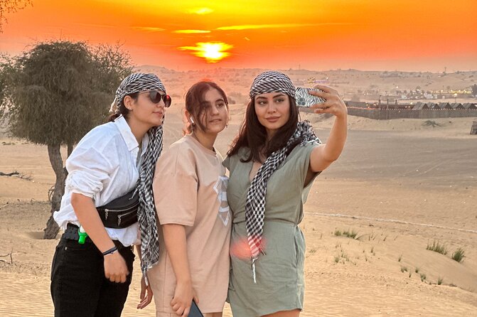 Dubai Sunset Red Dune Desert Safari, Sandboarding and Camel Ride - Lahbab’s red sand and the dune-bashing run