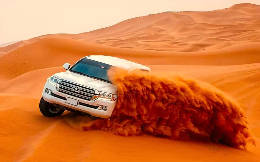 Dubai: Tour with BBQ Dinner, Camel Ride, & Traditional Show - A Dubai desert evening built around the camp