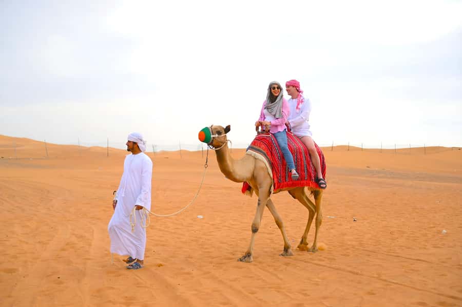 Dubai: Tour with BBQ Dinner, Camel Ride, & Traditional Show - Sunset, sandboarding and the optional action