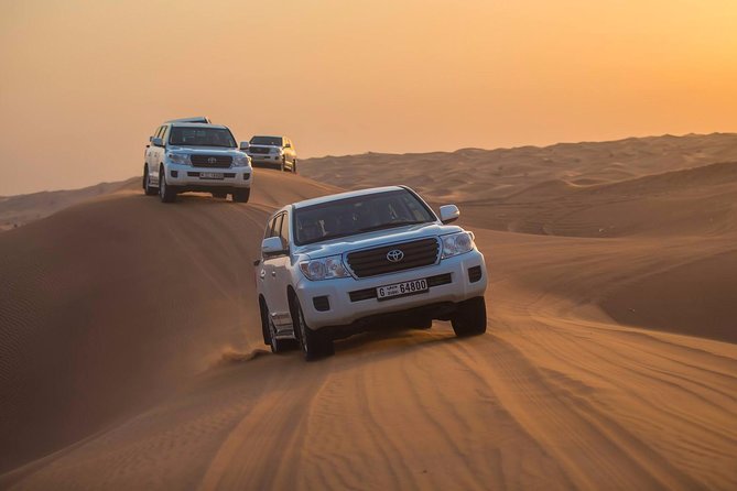 Evening Desert Adventure: Quad Biking, Sandboarding & Camel Ride - Tanoura, belly dancing, fire, and light shows