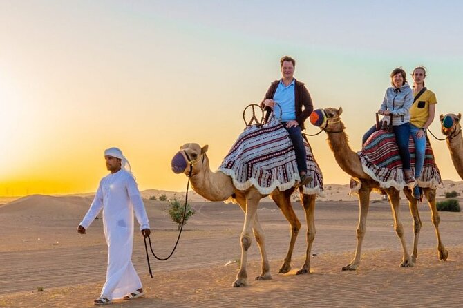 Evening Desert Safari Dubai with Camel Riding & BBQ Buffet Dinner - Camel riding and sandboarding at the dunes