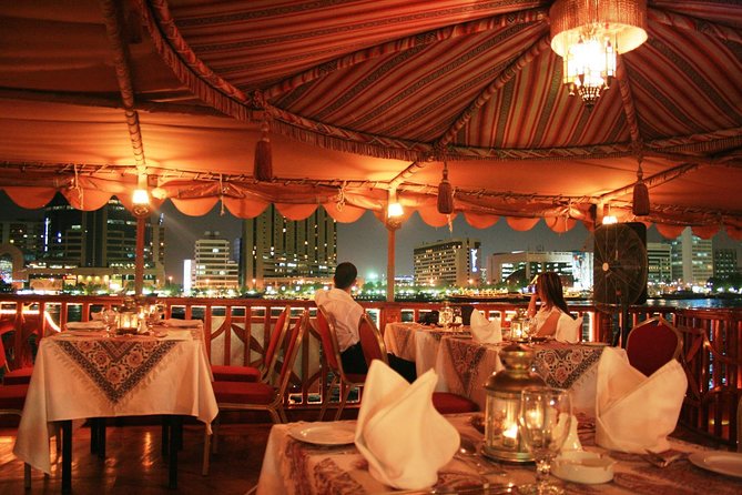 Evening Dhow Dinner Cruise in Dubai - Boarding a wooden dhow on Dubai Creek