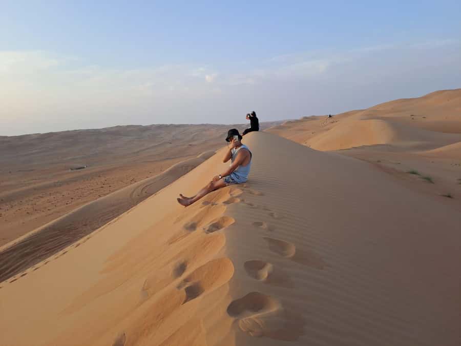 From Muscat: Guided Overnight Desert Camp Tour - Entering Wahiba Sands at sunset