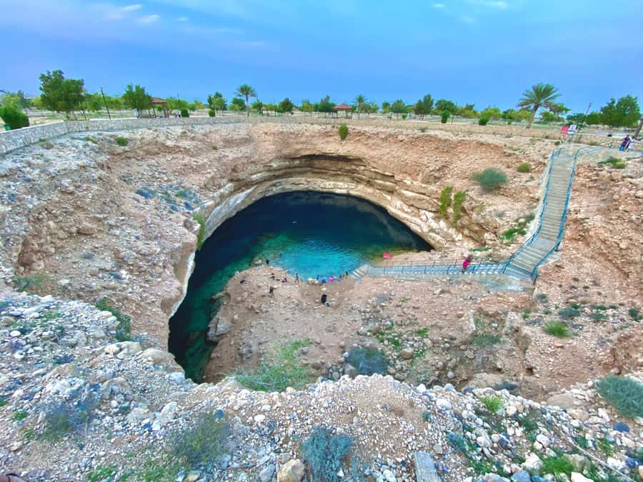 From Muscat: Wadi Shab & Bimmah Sinkhole Full-Day Tour - Swimming toward the cave waterfall