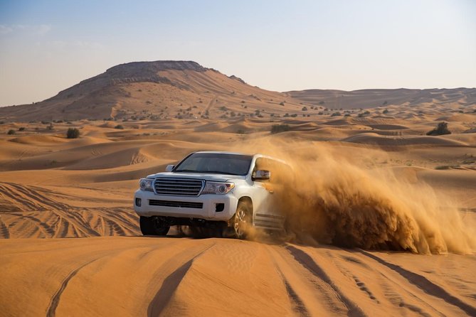 Half-Day Dubai Desert Safari With 7 Live Shows and BBQ Dinner - Six hours from city streets to red dunes