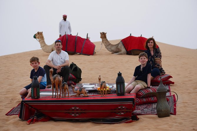 Morning Dubai Desert Safari with Camel Ride & Sand boarding - A short camel ride at the camp