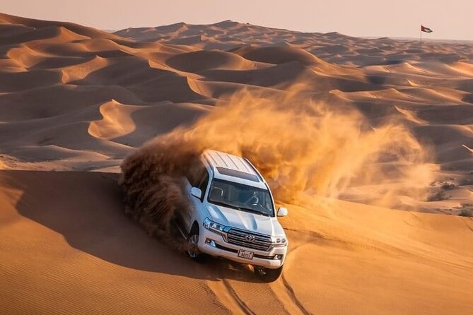 Morning Red Dunes Desert by Quad Bike, Dune Bashing, Camel Ride & Sandboarding - Quad biking gives you the first real burst of freedom