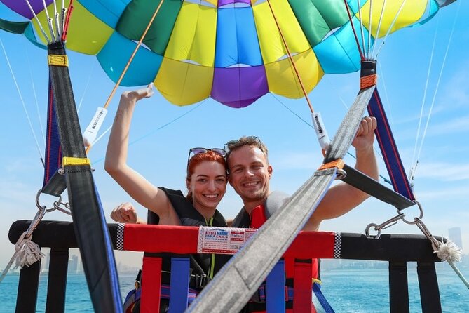 Parasailing in Dubai with Palm Jumeirah and JBR Beach views - From Dubai Harbour to open water