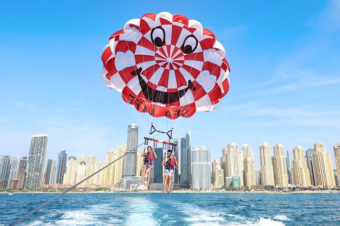 Parasailing in Dubai with Palm Jumeirah and JBR Beach views - Photos, videos, and keeping your hands free