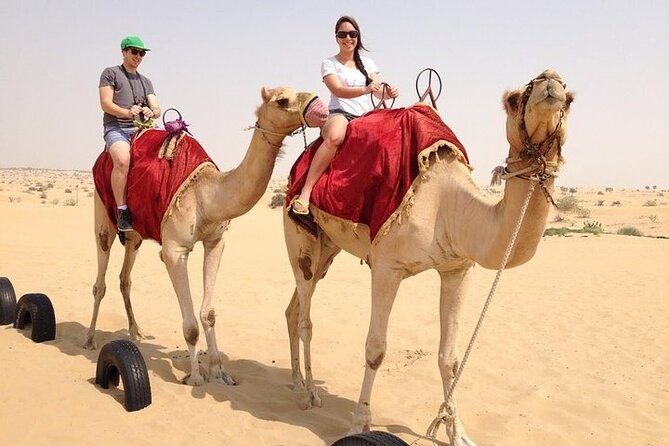 Premium Desert Safari Dubai: Desert Camping & Dune Bashing - Camels, henna, and local clothing at camp