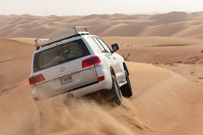 Premium Dubai Desert Safari with BBQ Dinner in the Red Dunes - Leaving Dubai’s Towers for the Lahbab Dunes